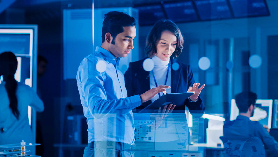 Two colleagues looking at tablet