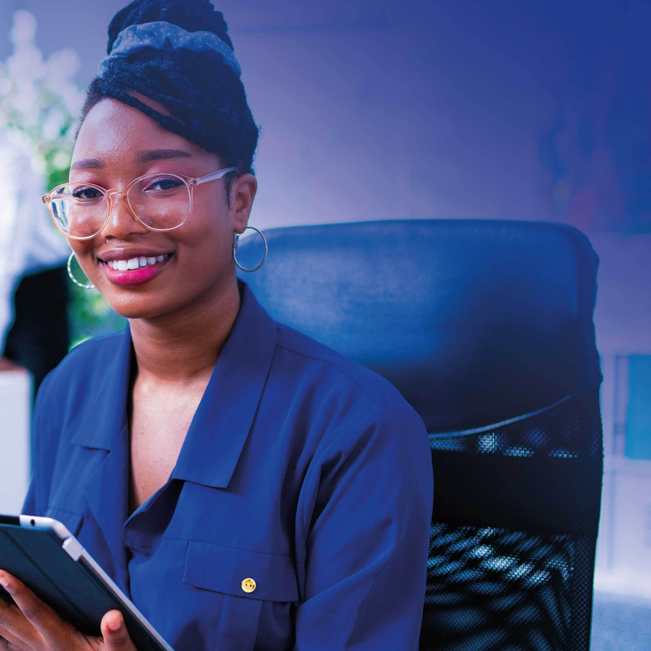 Continuation of business woman holding a tablet