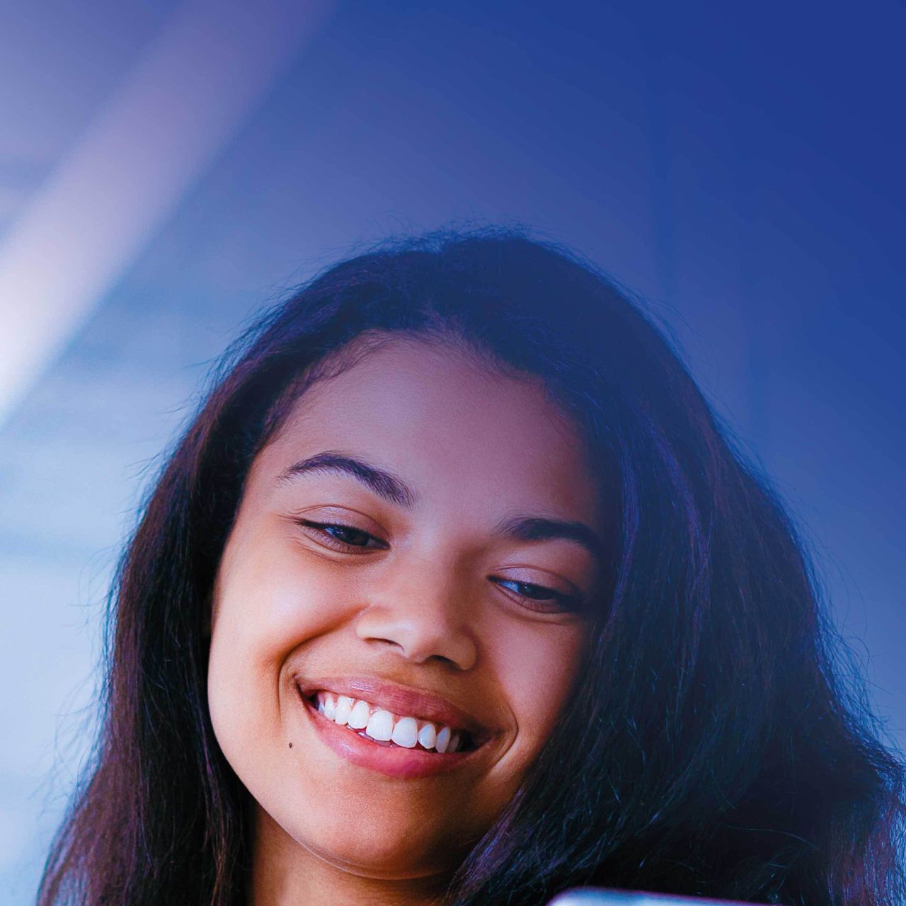 Mosaic image of two colleagues smiling and looking at tablet